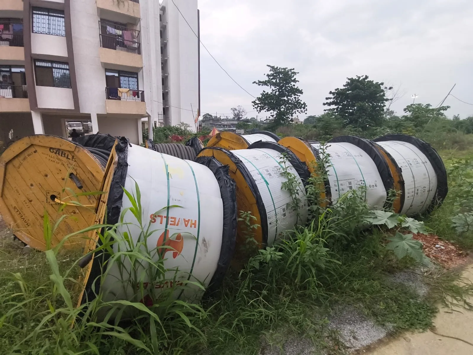 Conductor drums run out along rural village feeder line