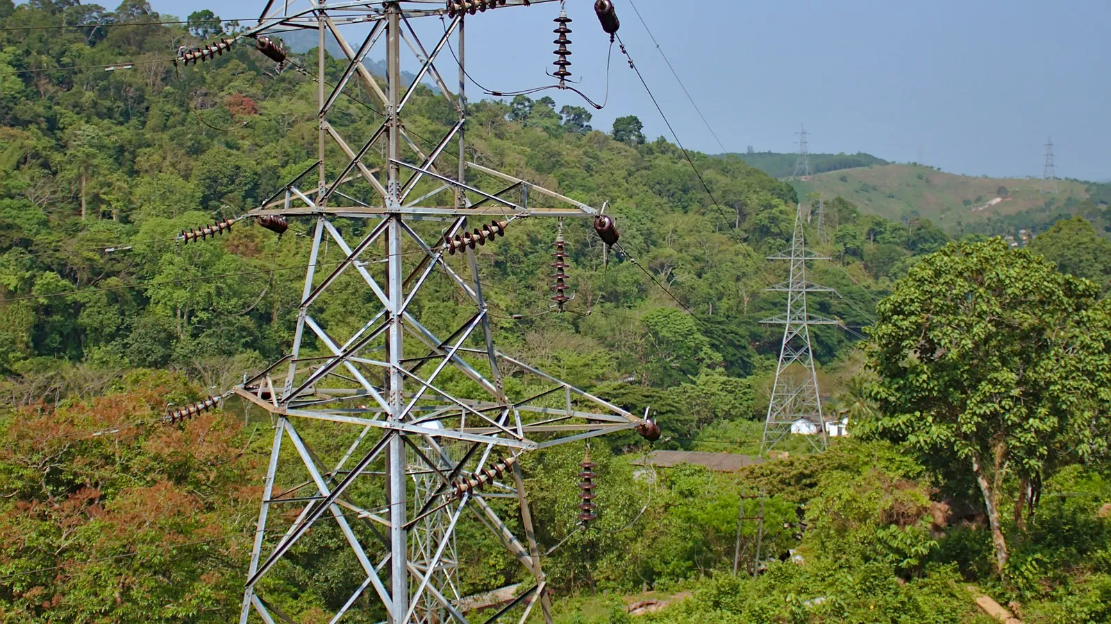 High-voltage 33 kV power transmission line corridor across industrial landscape